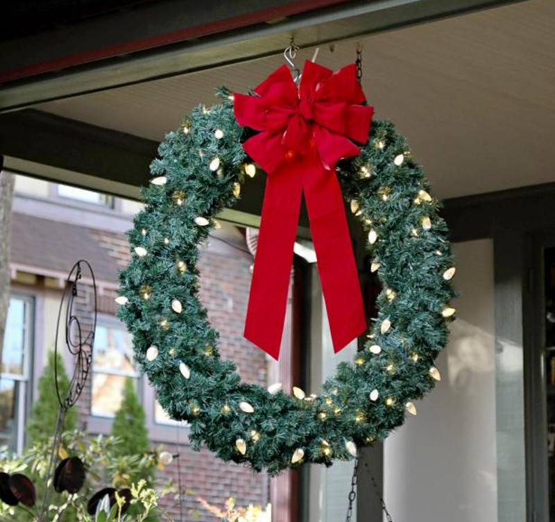 oversize wreath with oversize red ribbon