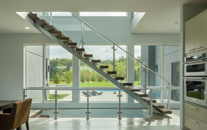 floating stairs with glass railings